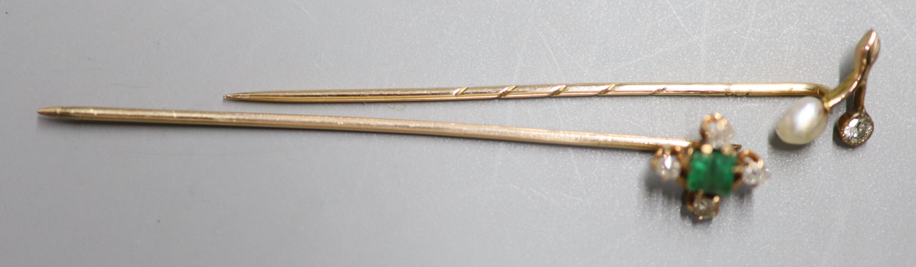 Two Edwardian yellow metal and gem set stick pins,